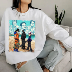 a woman sitting on a couch wearing a white sweatshirt with a picture of two men